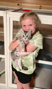 Our friends daughter, Ellie, holding Maine Coon kitten Patty Cakes