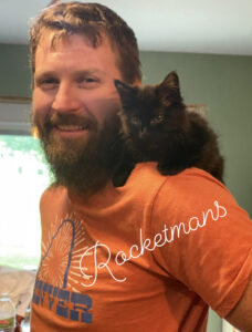 Rocket sitting on Rocketmans Owners shoulder